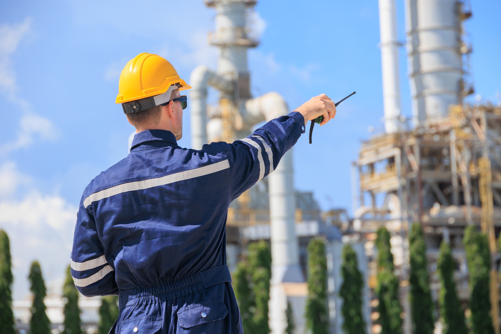 Refinery petroleum worker duty radio control operation. Industrial Engineer in oil and gas working